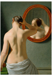 Woman looking in a mirror, adjusting her hair.
