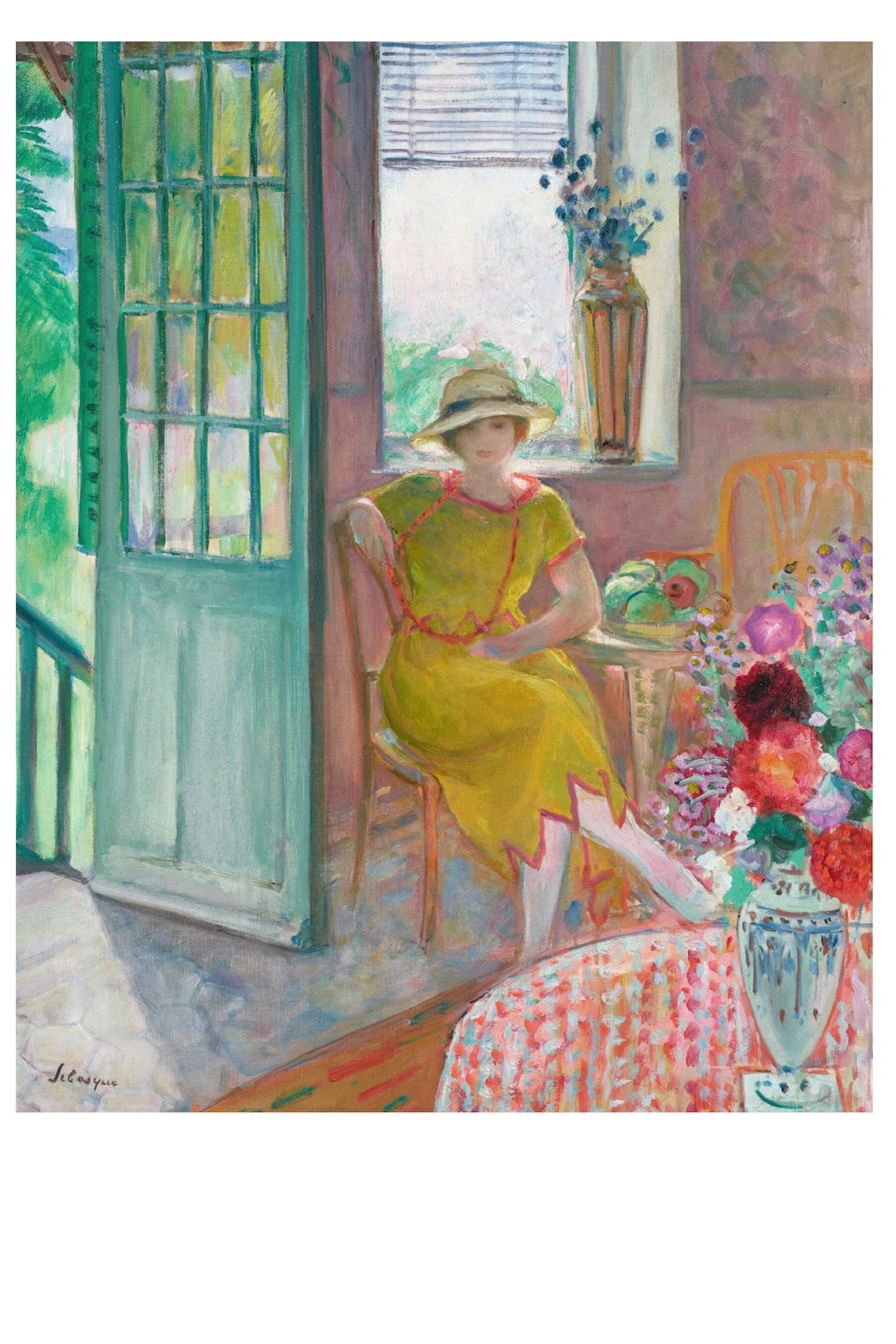 Woman in yellow dress seated near open door.