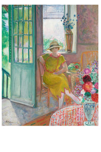 Woman in yellow dress seated near open door.