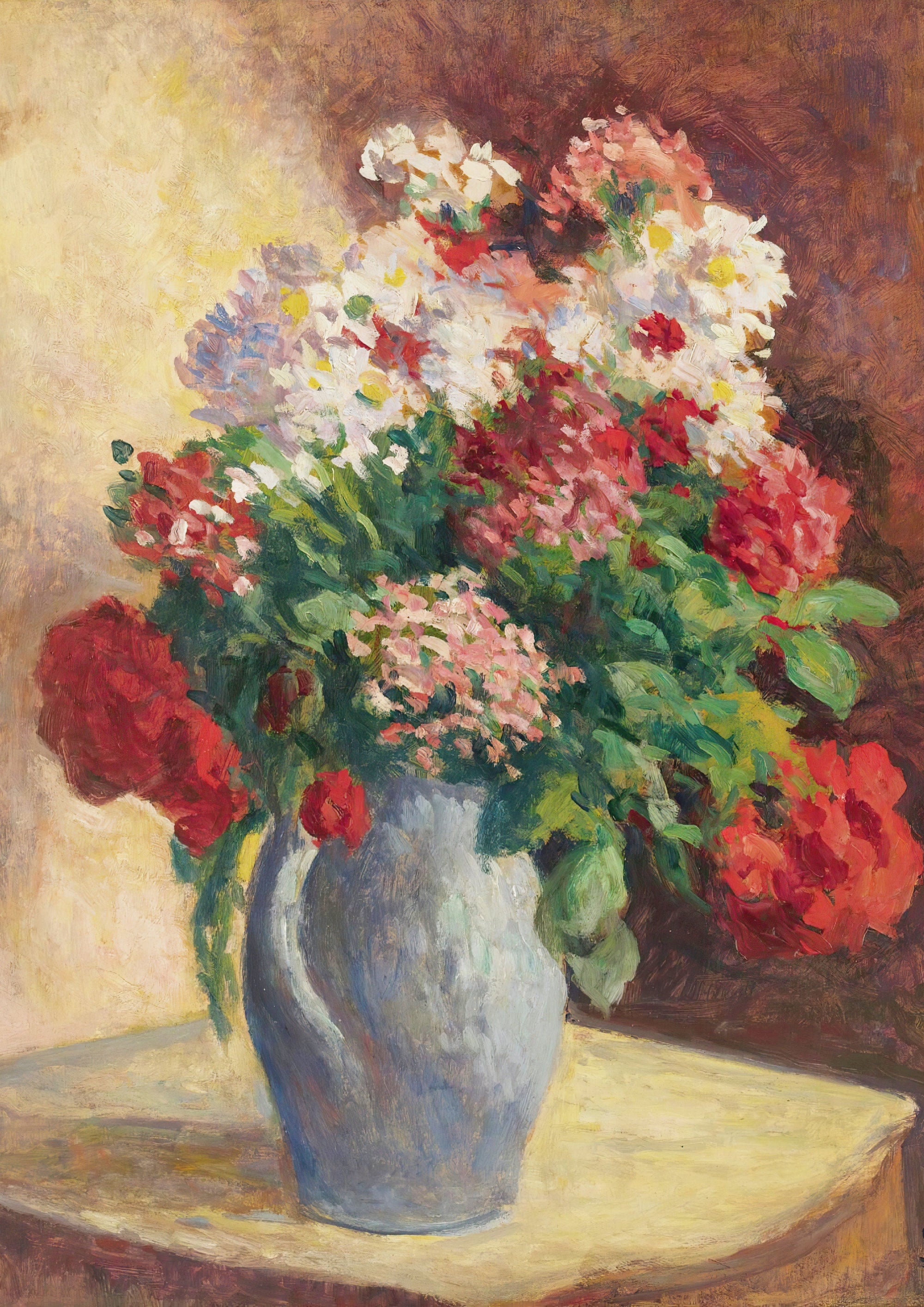 Flowers in a blue vase on a table.