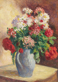 Flowers in a blue vase on a table.