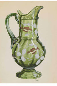 Green glass pitcher with fish and leaf design.