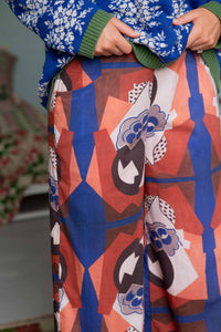 Agnes Jumper & Ollie composition - patterned trousers & blue sweater
