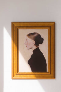 Art print of young girl in profile, framed