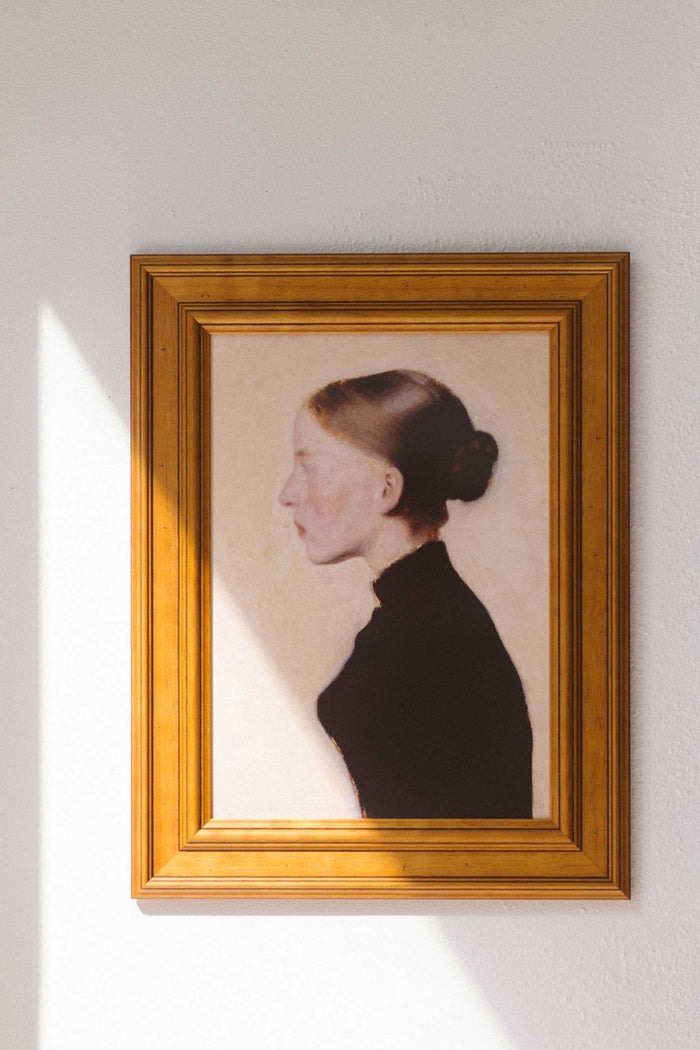 Art print of young girl in profile, framed