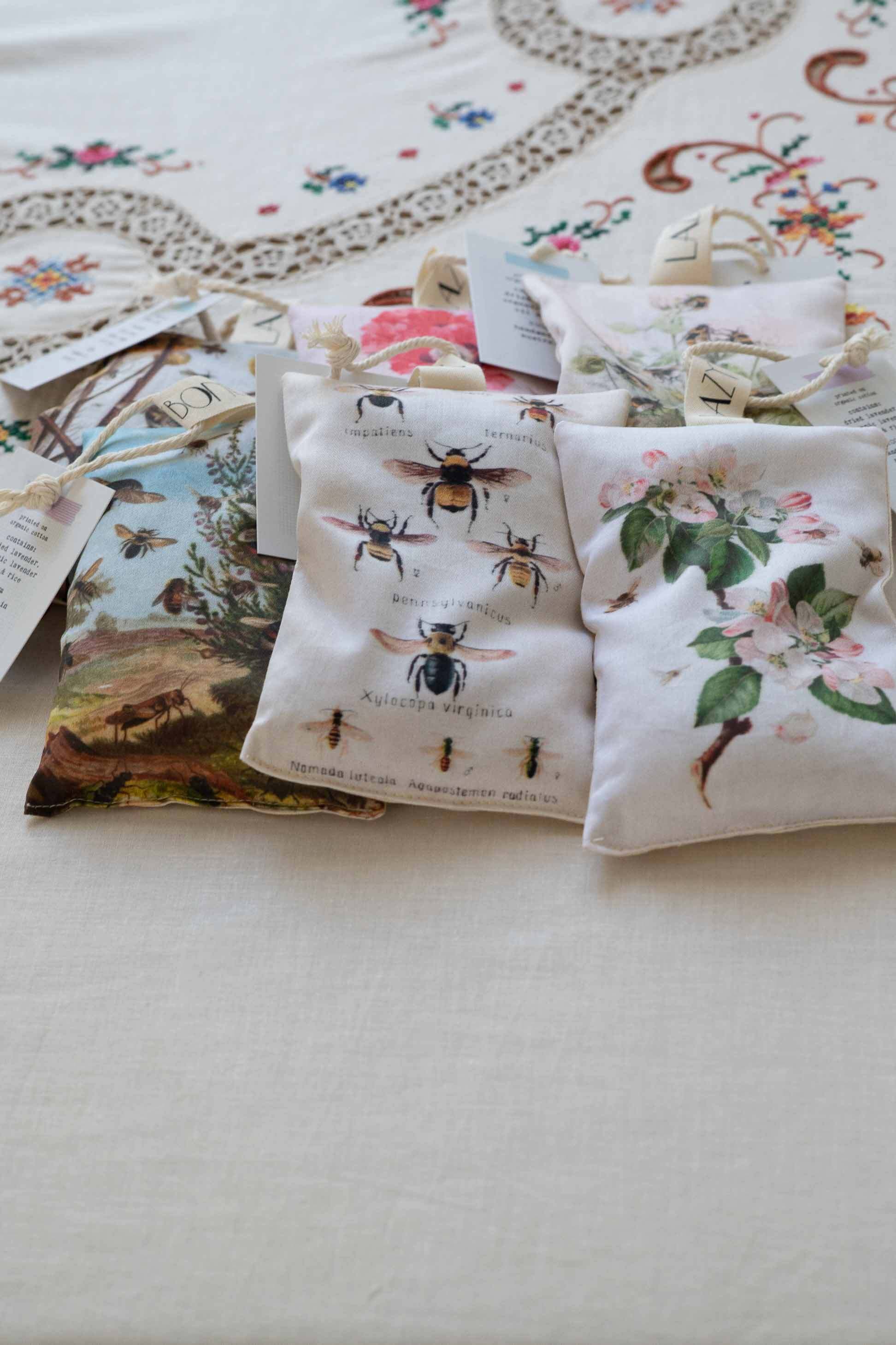 Bee sachets with floral and bee designs.