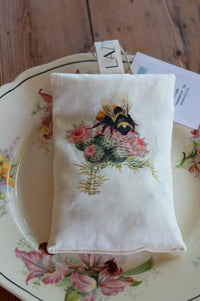 Bee scented sachet on decorative plate
