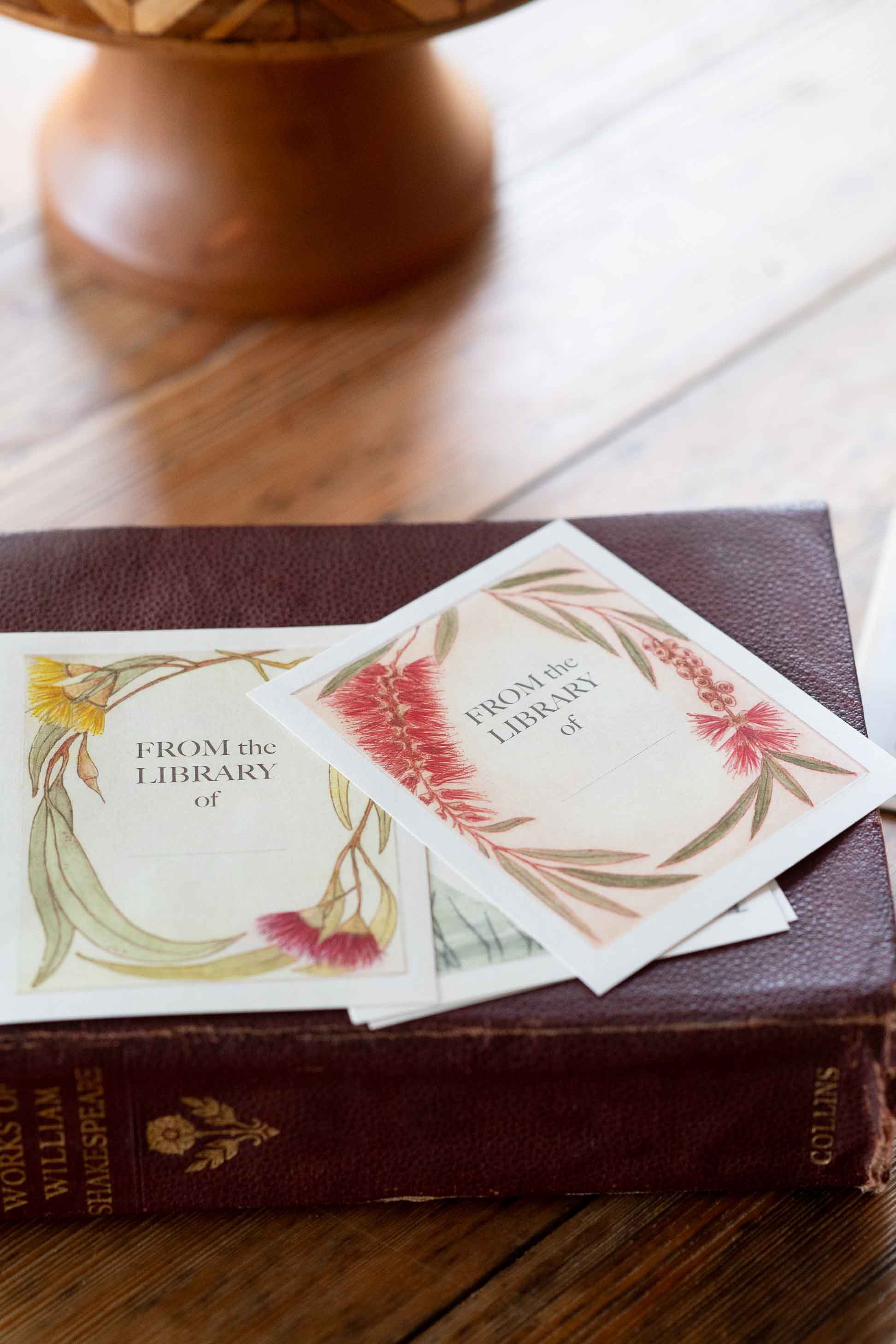 Bookplates on antique book, featuring floral design