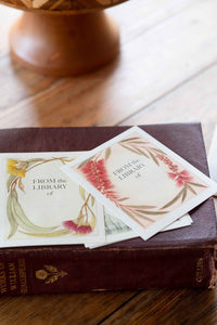 Bookplates on antique book, featuring floral design