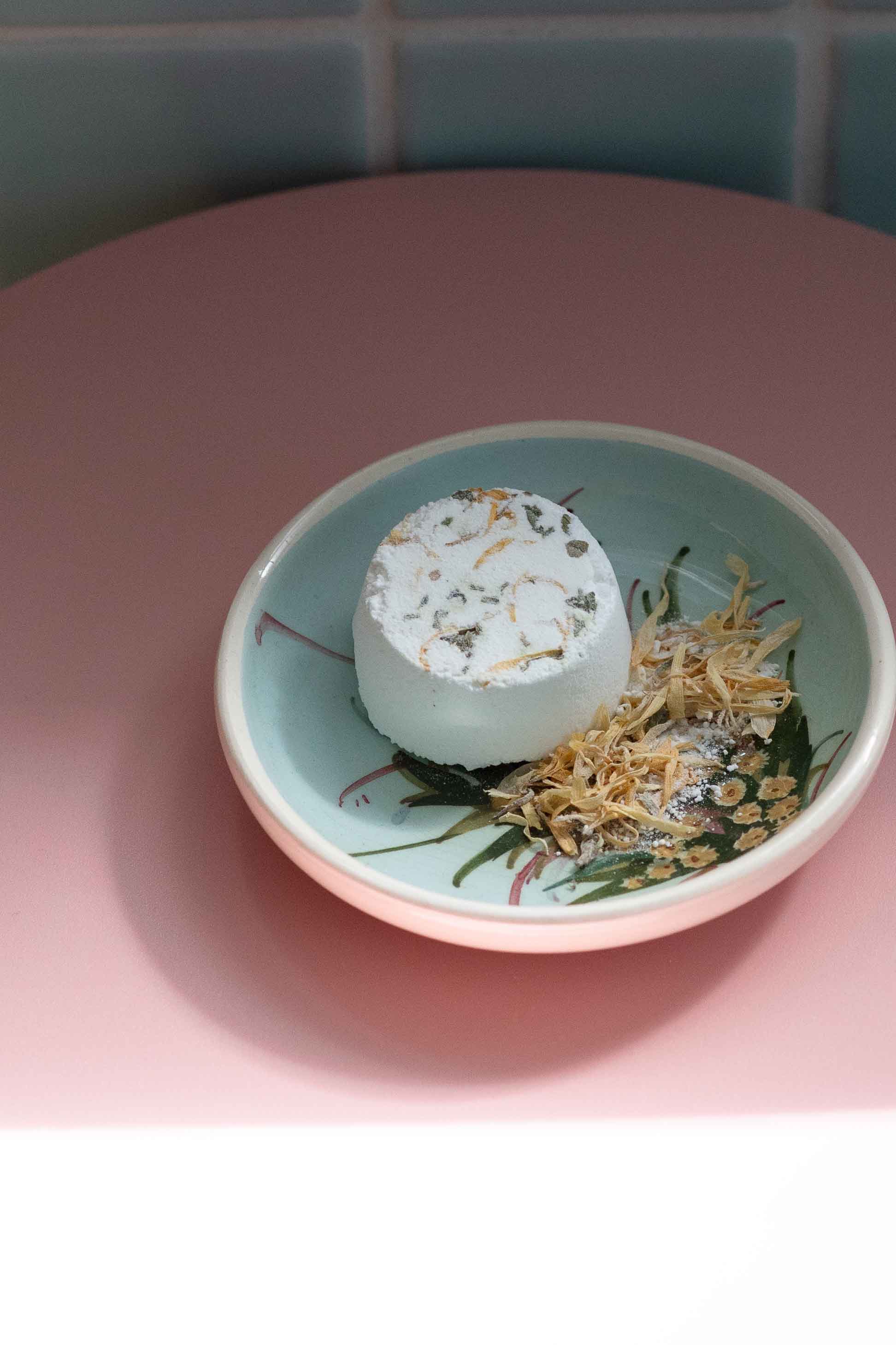 Breathe shower steamer in a decorative bowl