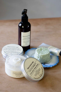 Charlotte's Lab skincare products including body butter and lotion.
