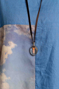 Crystal Locket Oval Necklace on Blue Fabric