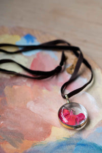 Round crystal locket necklace with red detail