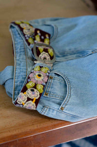Embroidered belt on light wash jeans - DSC5058