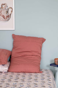 Pink pillow on bed, DSC9569