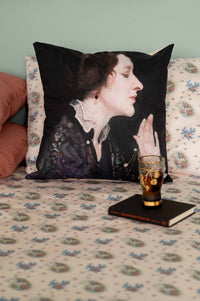 Pillow with portrait and glass on bed, DSC9597