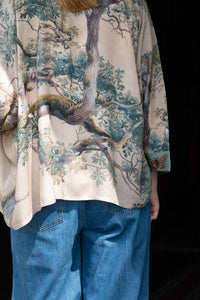 Earth Sky Kimono with tree print and denim jeans
