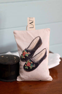 Embroidered slippers image on a pillow