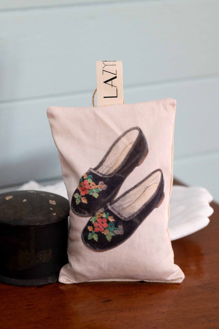 Embroidered slippers image on a pillow