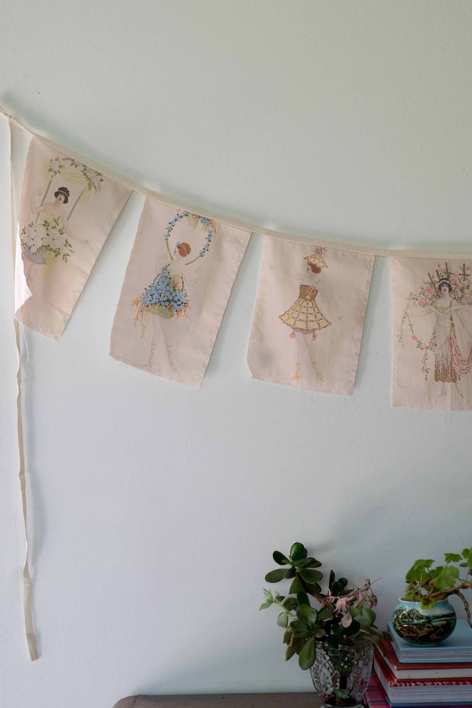 Flower girl garland with embroidered flags.