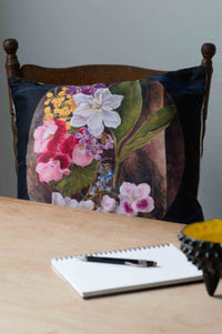 Flower study cushion with floral design on chair