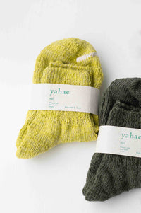 Pair of green and yellow knit socks