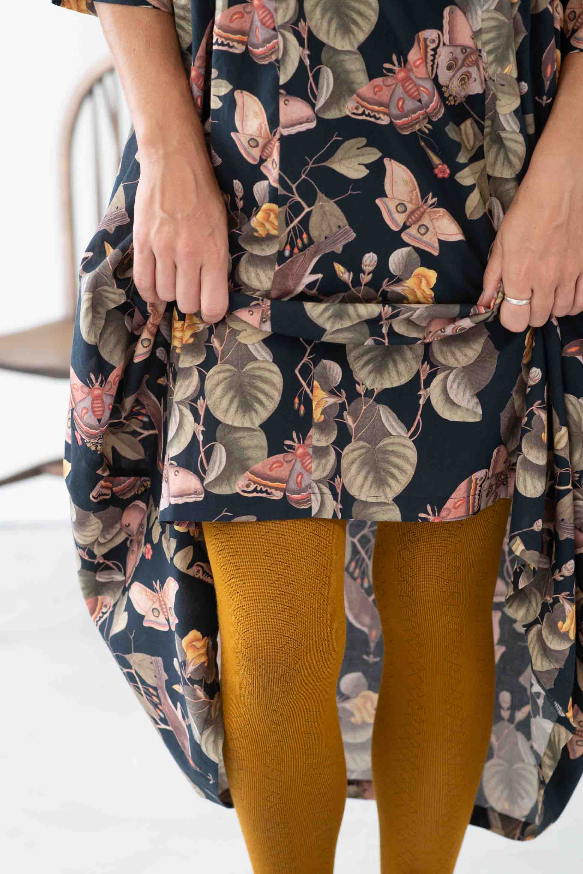 Adele Merian floral dress with geo ochre tights