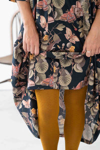Adele Merian floral dress with geo ochre tights