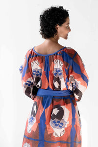 woman in patterned dress