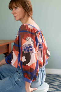Woman wearing Hetti Top with Ollie Denim jeans