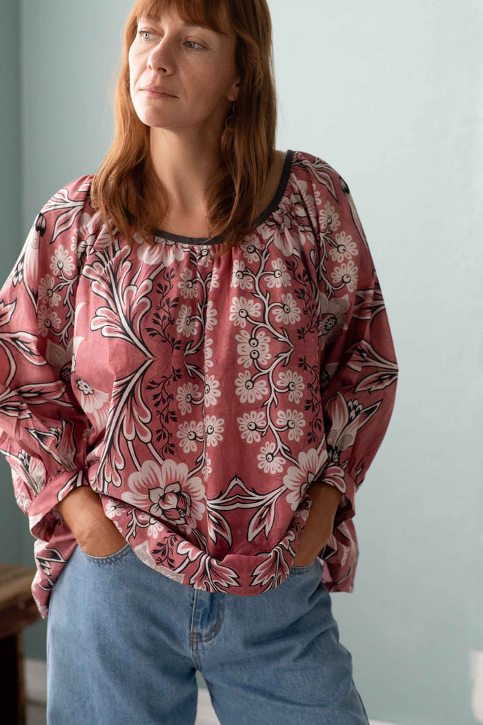 Woman in Hetti Top with French floral design and Lucy Jeans