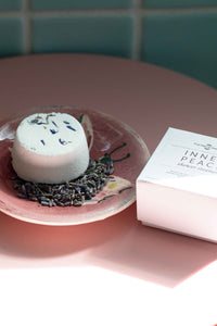 Inner Peace shower steamer on a pink plate