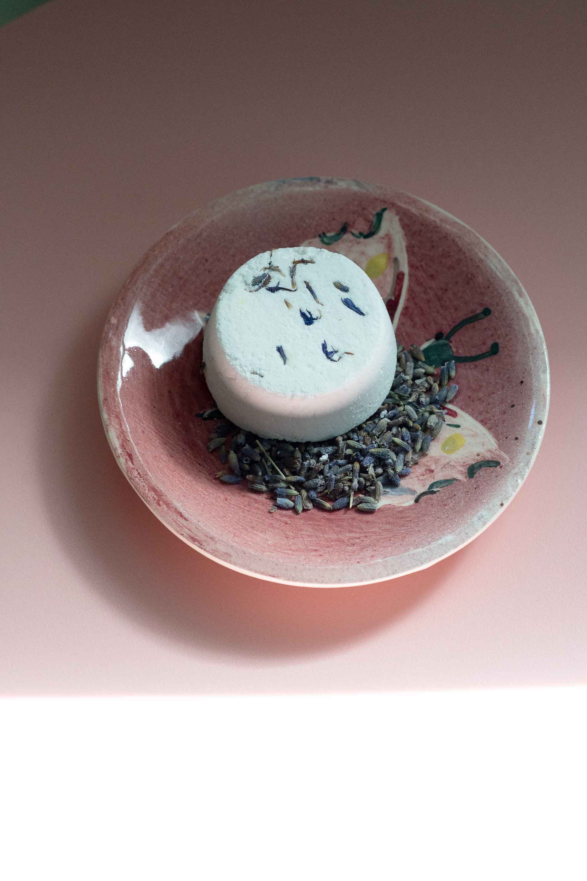 Inner Peace Shower Steamer on pink dish