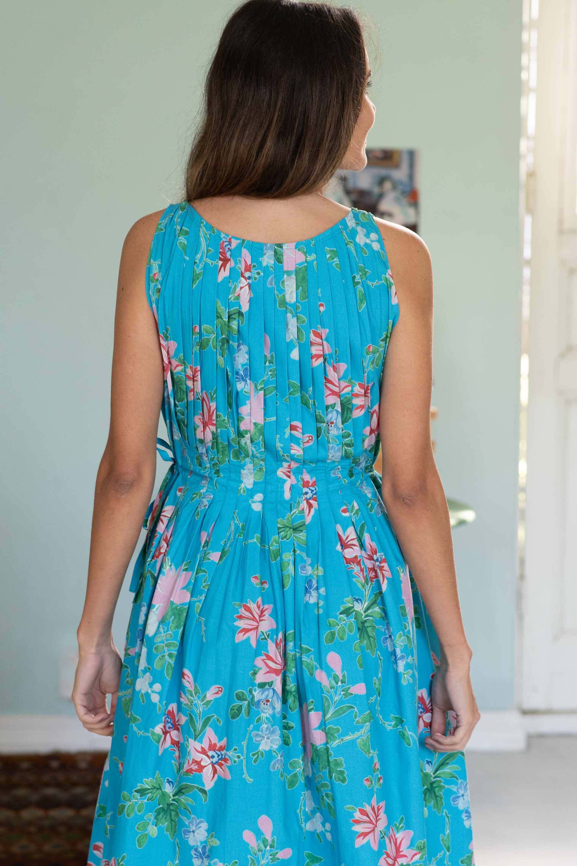 Katy Bluesette in a floral turquoise dress