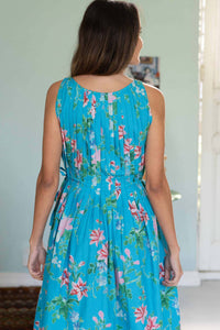 Katy Bluesette in a floral turquoise dress