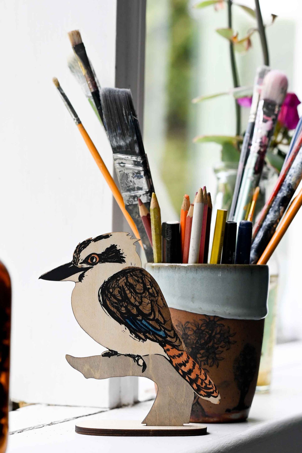 Kookaburra art stand with paintbrushes and pencils