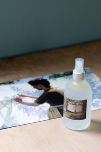 Lemongrass linen spray bottle with vintage art background