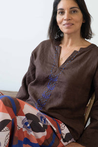 Marli Chicory Ollie in brown top and colorful skirt