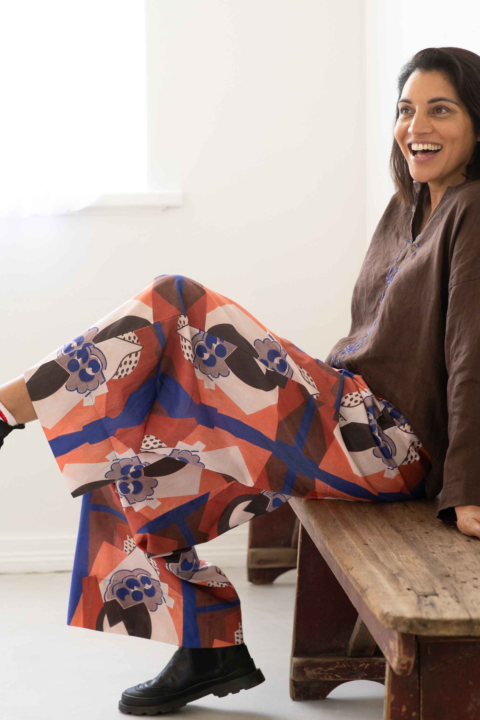 Ollie Marli Chicory pants, woman sitting and smiling
