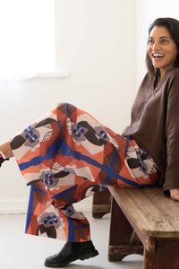 Ollie Marli Chicory pants, woman sitting and smiling