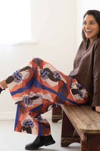 Ollie Marli Chicory pants, woman sitting and smiling