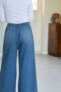 Ollie Denim Fanny Tee, rear view of denim pants and white top