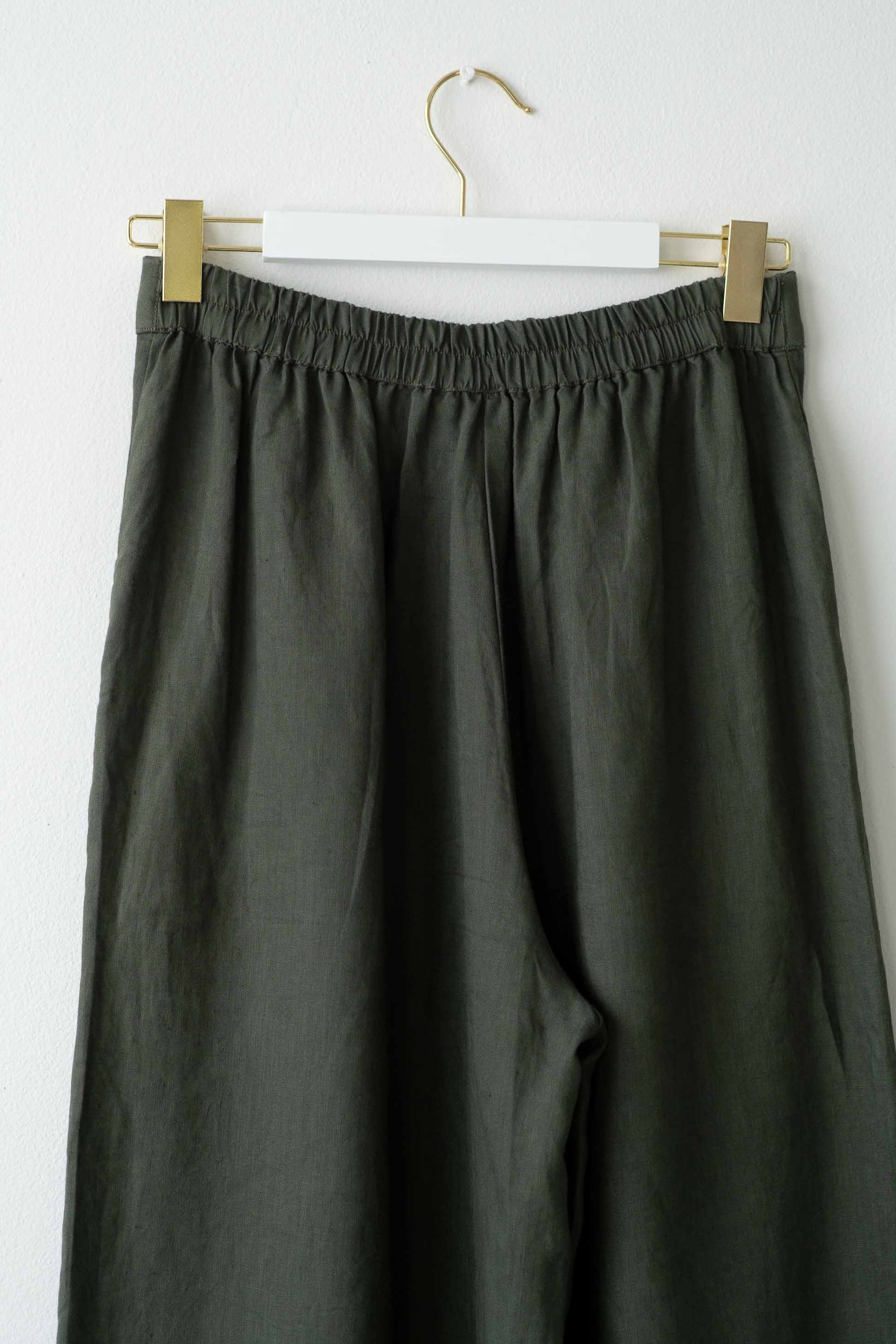 OllieThyme green linen pants on hanger