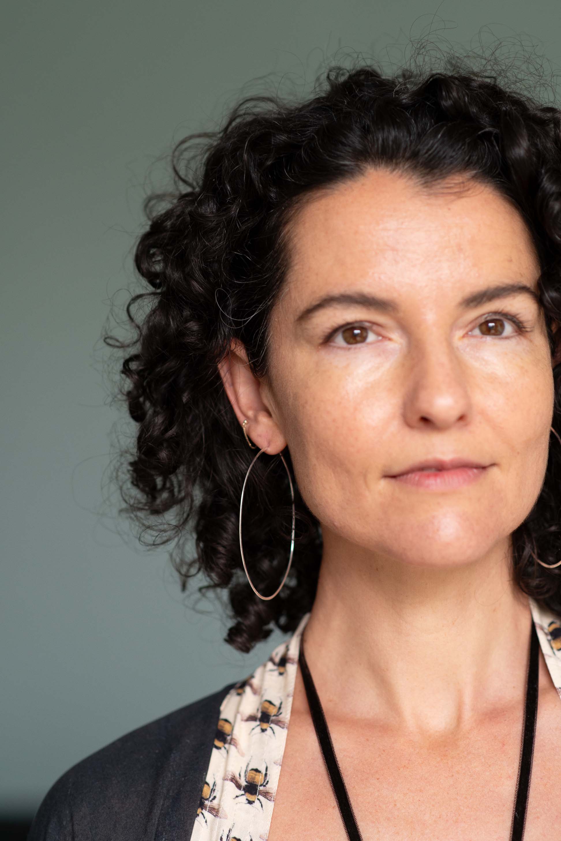 Woman wearing silver hoop earrings
