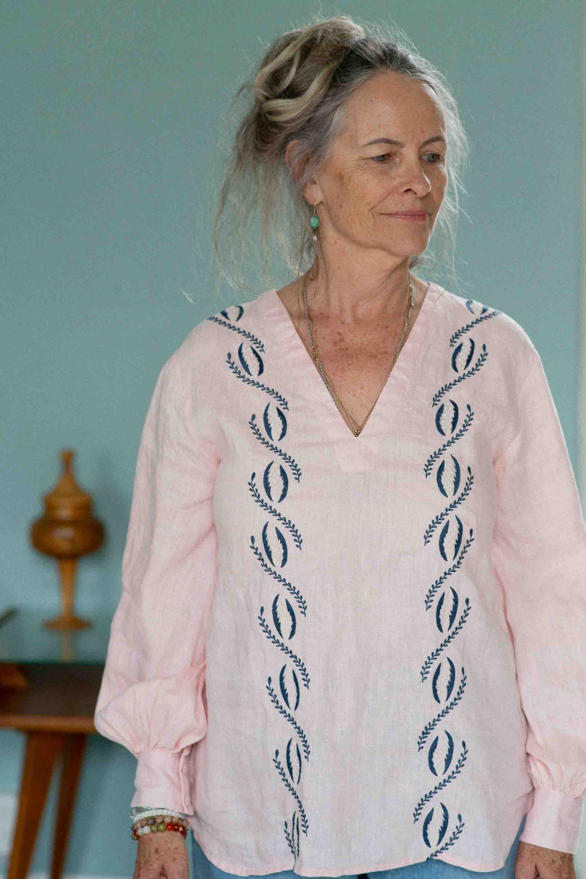 Woman in pink SimonaTop blouse