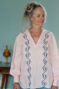 Woman in pink SimonaTop blouse