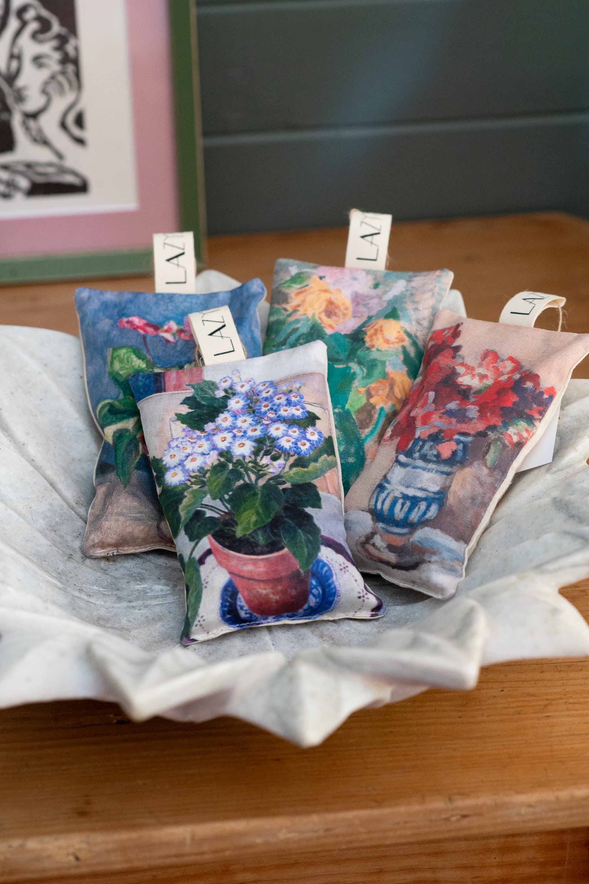 Scented sachet still life with floral designs.
