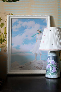 Woman in white dress with blue sky background