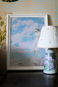Woman in white dress with blue sky background