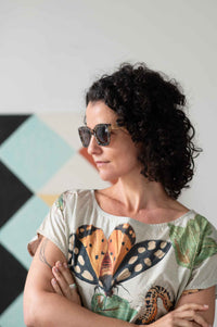 Eleanor wearing sunglasses with insect-themed shirt